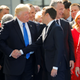 Trump shakes hands with French president Emmanuel Macron in front of NATO leaders in May 2017.